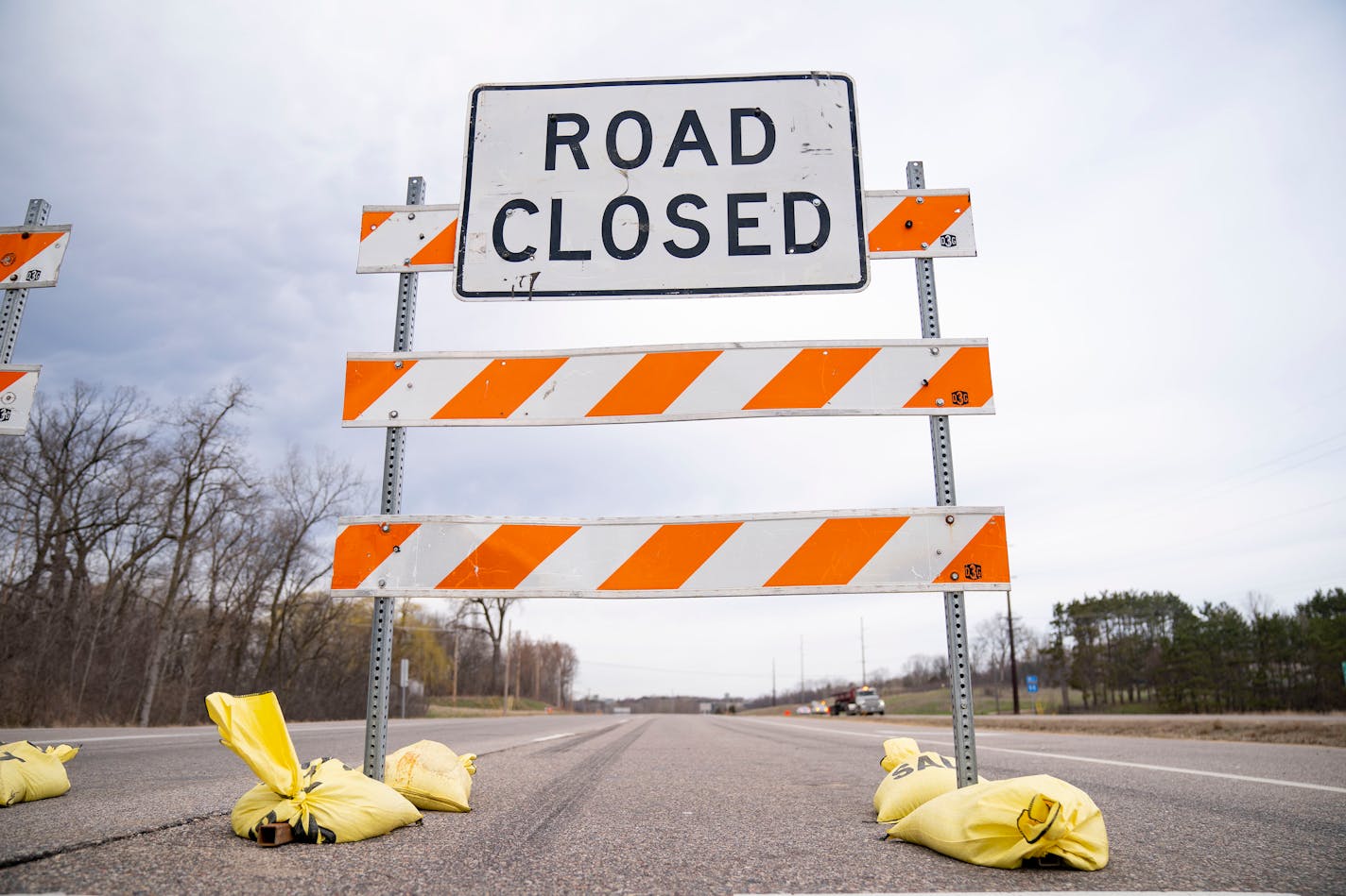 Road closed sign on highway.