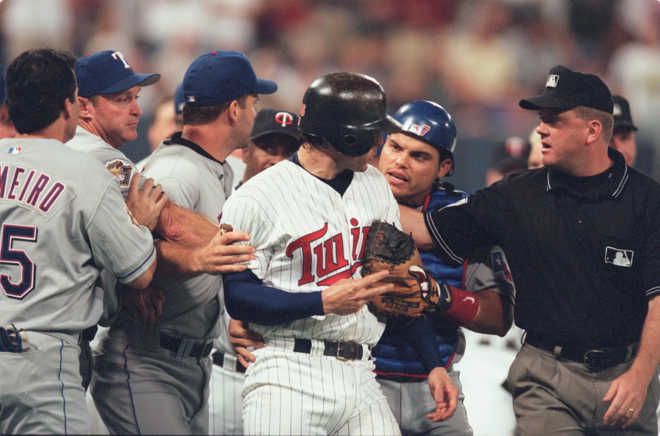 Doug Mientkiewicz and Rangers catcher Ivan Rodriguez exchange words after Mientkiewicz was hit by a pitch.