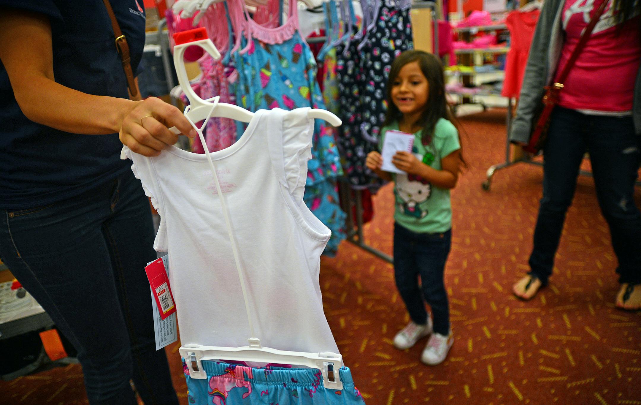 500 students shopped for brand new back-to-school clothes - some of them for the first time. Because of Salvation Army donors these at-risk kids, with the help of their volunteer chaperones, loaded up with $80 worth of shirts, pants and sneakers. At 11 retailers across the metro area. Salvation Army volunteer Lisa Beier, a girls clothing designer for Target helped out 5 year old Kelsy Marquez of Minneapolis. shop for clothes. It turns out that Kelsy choose one of Lisa's designed Pajamas which sh