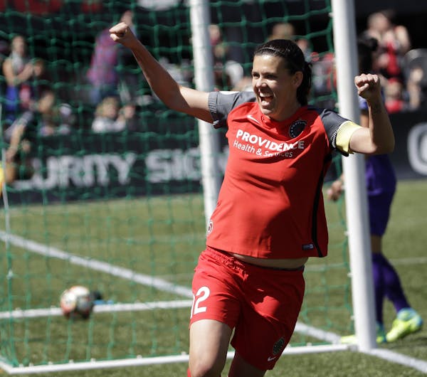 FILE - In this April 15, 2017, file photo, Portland Thorns forward Christine Sinclair celebrates scoring a goal during the second half of their NWSL s