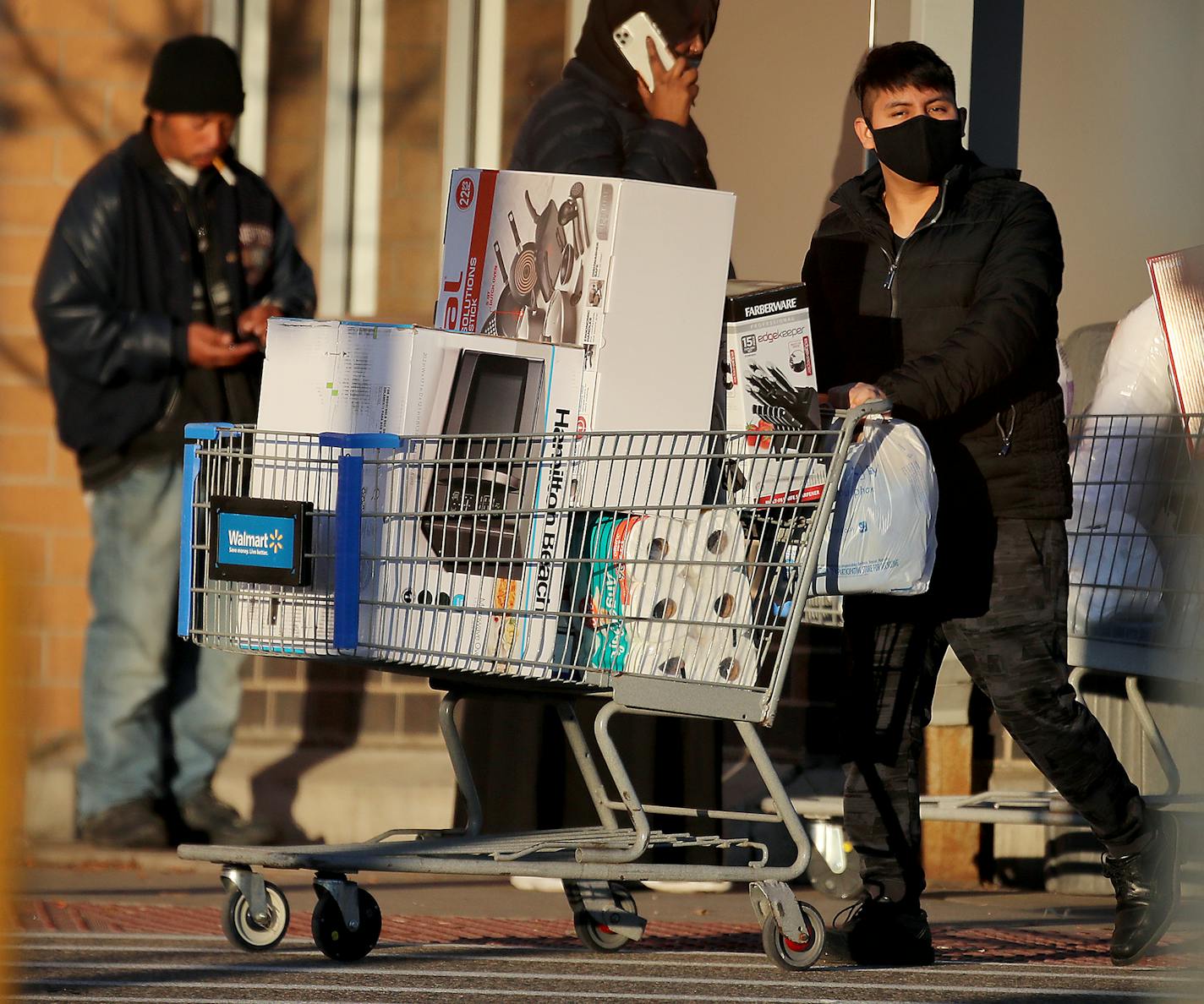 A shopper came away with a cart full of deals at Walmart during Black Friday in Bloomington. ] DAVID JOLES • david.joles@startribune.com Friday, Nov. 27, 2020 in Bloomington, MN With many consumers worried about the spread of the coronavirus and most stores offering holiday deals early and online, how will this year's Black Friday look? Will people venture to brick-and-mortar stores? Will there be lines?