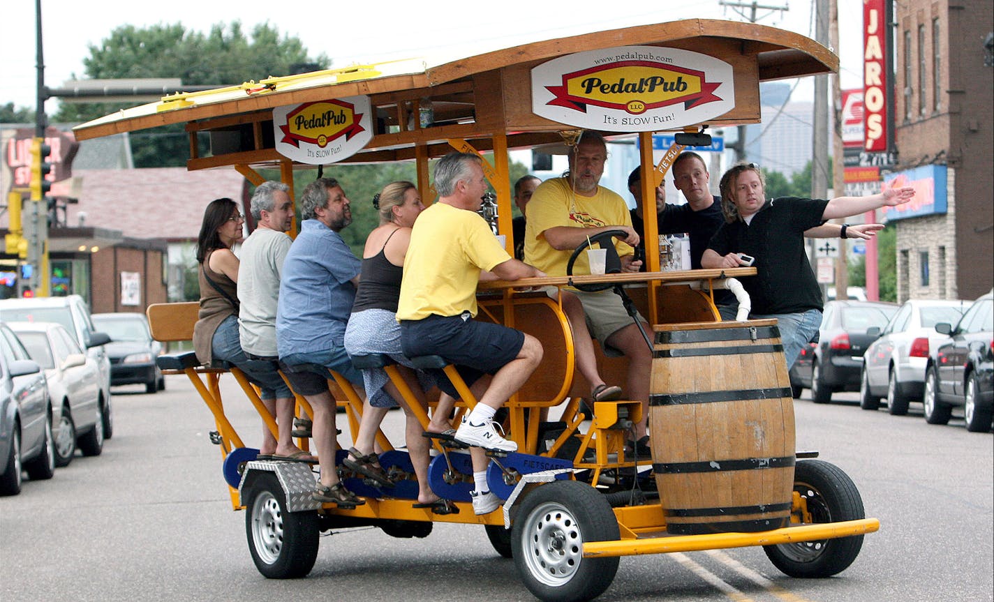 TOM WALLACE &#x2022; twallace@startribune ASSIGN#112460_SLUG_night0831.#112460_8/9/2007 Al Boyce, and Eric Olson on the left, managing partners, of the Pedal Pub take the right. This Pedal Pub tour made its way through the Northeast neighborhood route Wednesday around NE, visiting various bars. They start at the 1029 Bar, departing at 6 p.m. ____The Pedal Pub, creation that is basically a 16-person bar on wheels. The only one of it's kind in the country, customers jump on the Pedal Pub and pedal