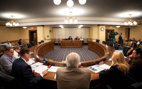 Members of the State Legislative Audit Commission listen on June 13 as Special Reviews Director Katherine Theisen and Legislative Auditor Judy Randall