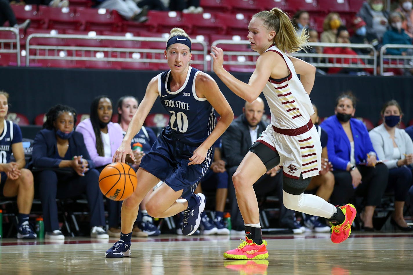 Penn State's Makenna Marisa (20) is defended by Boston College's Cameron Swartz (1) during the second half of an NCAA basketball game on Thursday, Dec. 2, 2021, in Chestnut Hill, Mass. (AP Photo/Stew Milne)