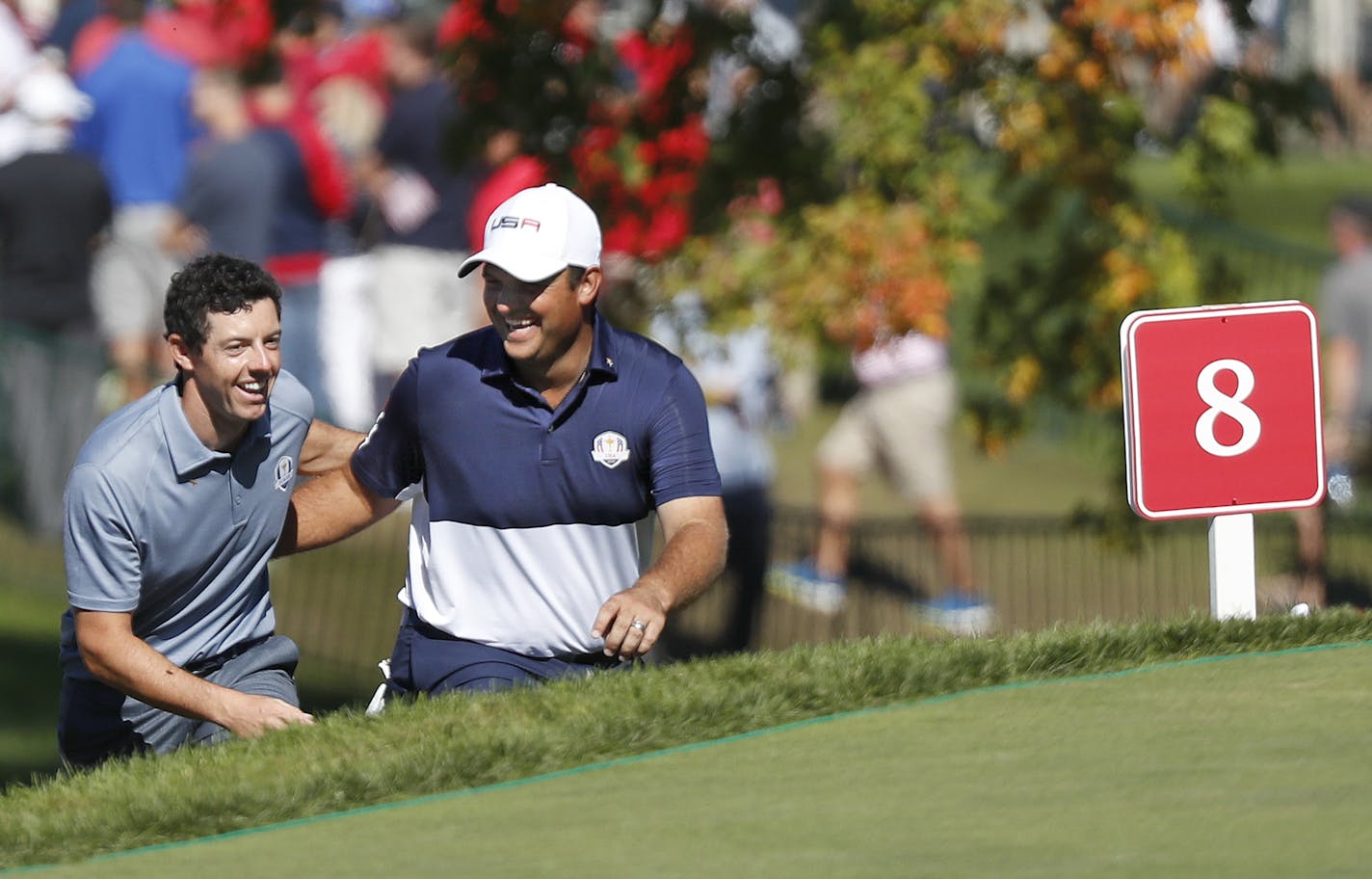 USA golfer, Patrick Reed and European, Rory McIlroy, show respect to each other as they approach to the 8th tee box during the Sunday morning match play. ] CARLOS GONZALEZ cgonzalez@startribune.com - The Ryder Cup match play Sunday October 2, 2016 at Hazeltine National Golf Club in Chaska, Minn.