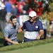 USA golfer, Patrick Reed and European, Rory McIlroy, show respect to each other as they approach to the 8th tee box during the Sunday morning match pl