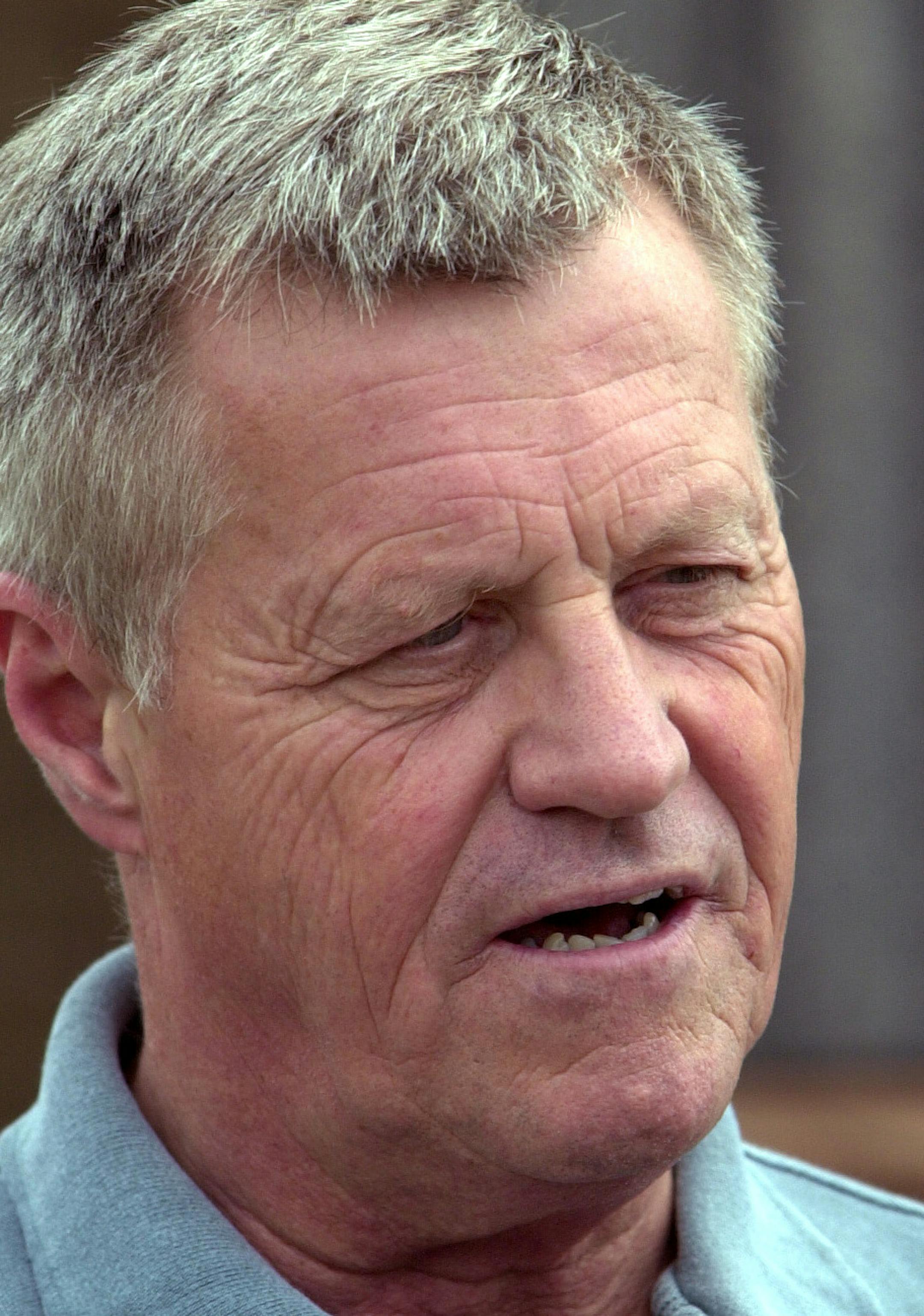 STAR TRIBUNE PHOTO BY RICHARD SENNOTT. GENERAL INFORMATION: Bird Island, Mn. Thursday 8/15/2002 flying around western Minnesota in a 4-seat aircraft piloted by Rep. Collin Peterson, D-Minn., taking off from either Olivia or Bird Island, in Renville Co. IN THIS PHOTO: Rep. Collin Peterson, D-Minn. goes on a walking Tour of Bird Island, Mn., with mayor Paul Heyl.