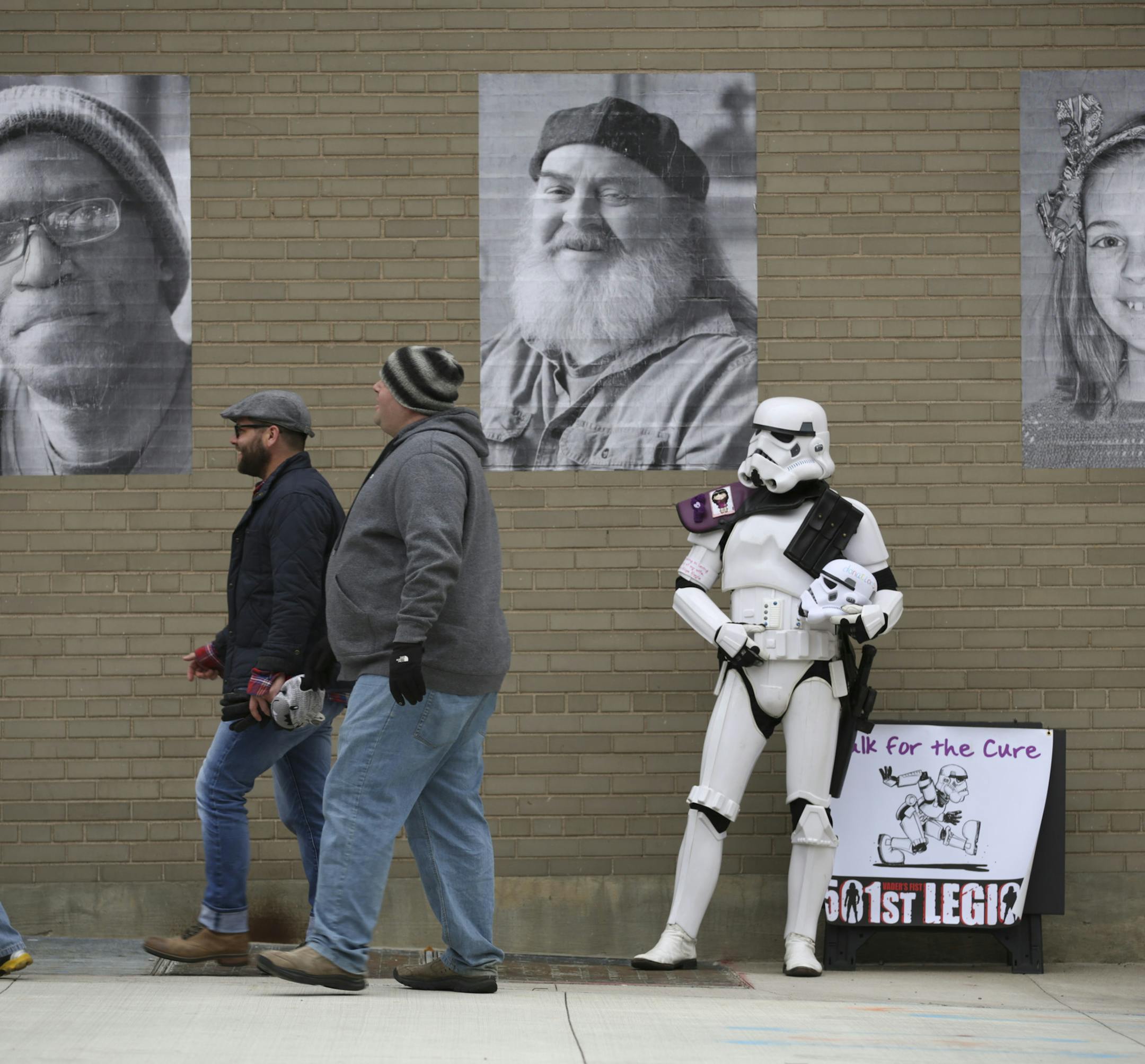 Kevin Doyle stood near the entrance to the new Saints stadium dressed as a Star Wars Imperial Stormtrooper before Monday night's game. He's does it to call attention to a fundraising walk he's going to do this summer - in costume - from San Francisco to San Diego and back again to raise money to fight cancer. He has done previous walks to honor his wife, Eileen Shige Doyle, who died of cancer. ] JEFF WHEELER ï jeff.wheeler@startribune.com St. Paul Saints fans got a preview of the new CHS Fi