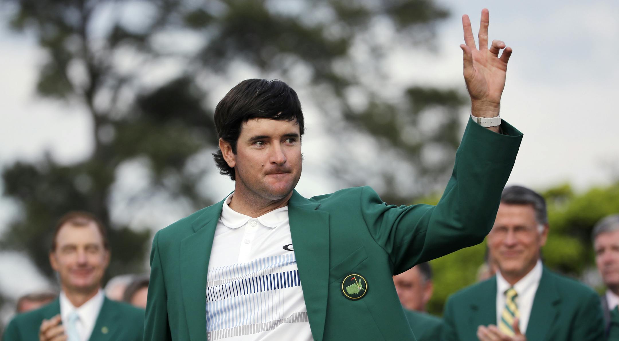 Bubba Watson waves after being presented with his green jacket after winning the Masters golf tournament Sunday, April 13, 2014, in Augusta, Ga. (AP Photo/David J. Phillip)