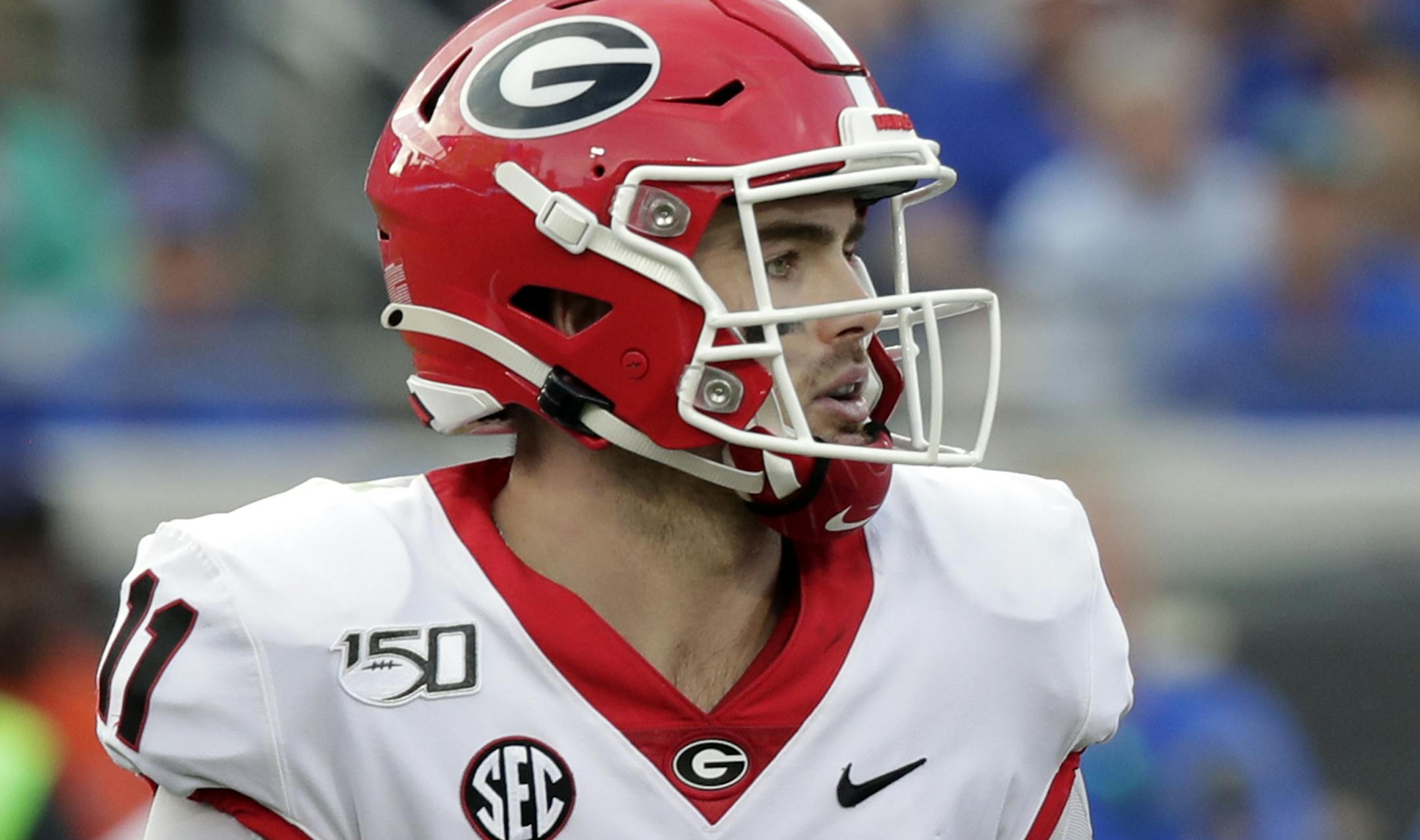 Georgia quarterback Jake Fromm looks for a receiver during the second half of an NCAA college football game against Florida, Saturday, Nov. 2, 2019, in Jacksonville, Fla. (AP Photo/John Raoux)