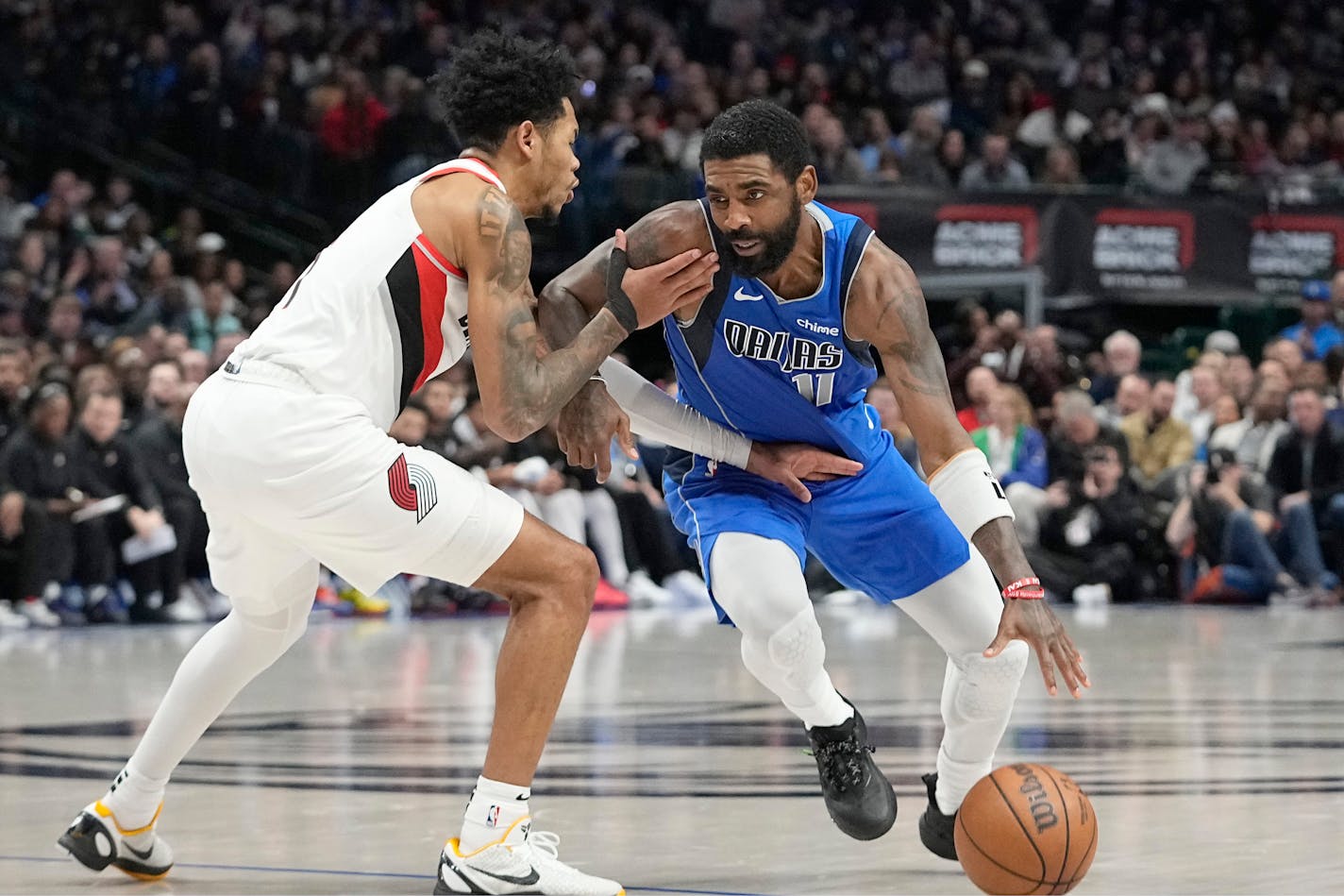 Dallas Mavericks guard Kyrie Irving (11) drives during the first half of an NBA basketball game against the Portland Trail Blazers in Dallas, Friday, Jan. 5, 2024. (AP Photo/LM Otero)