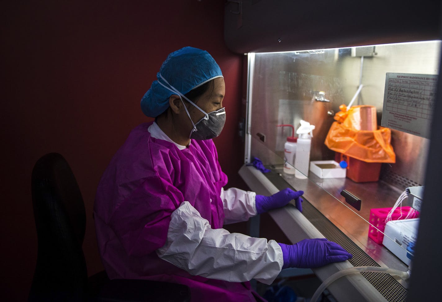 FILE -- A scientist works with the Zika virus at a lab run by the National Institutes of Health, which faces a proposed cut of 18 percent, in Bethesda, Md., April 6, 2016. Scientists expressed alarm at the depth of proposed cuts to climate change, medical and energy programs, saying they threaten the nation&#x2019;s research infrastructure.