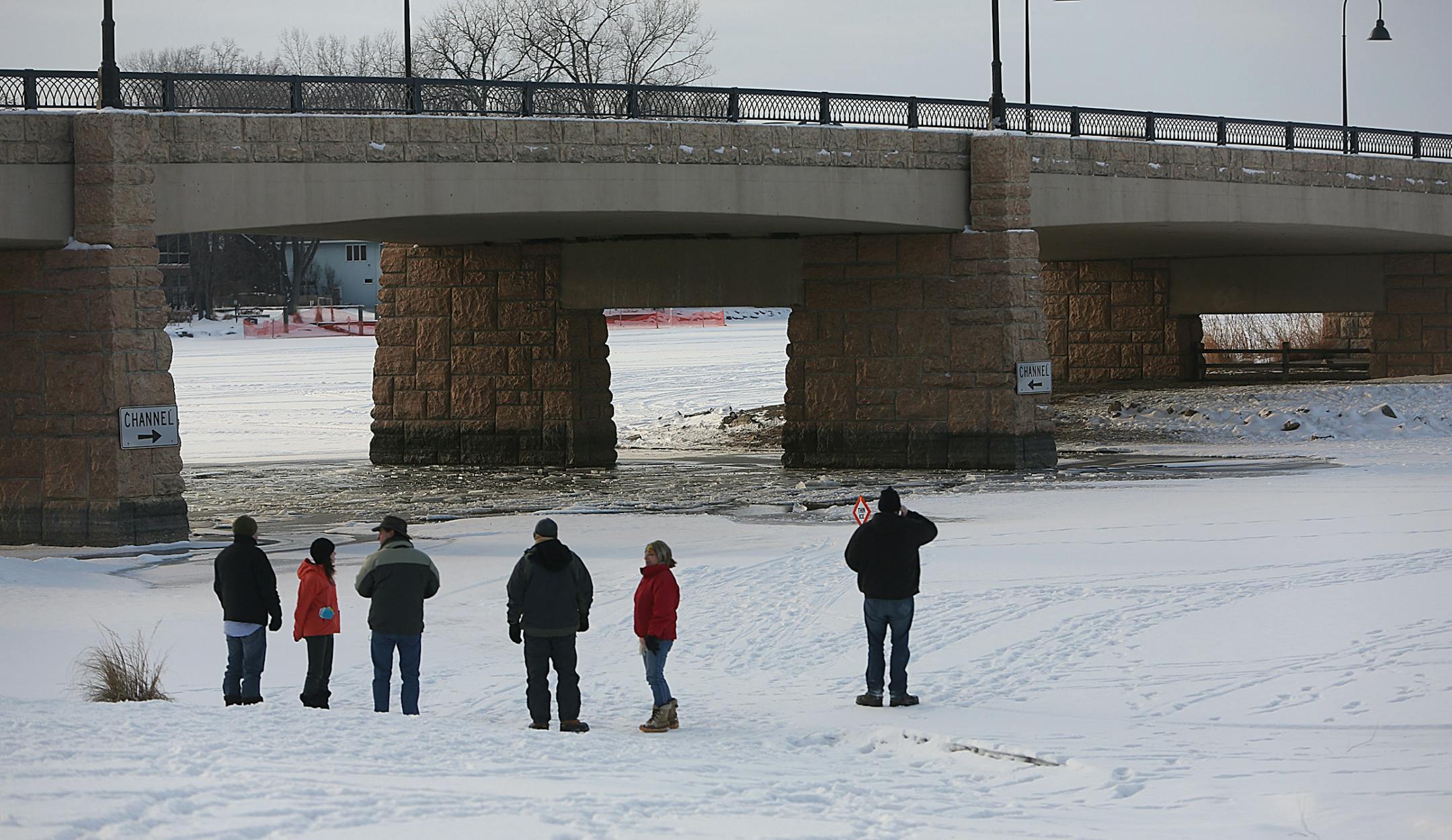 People gathered near the scene where a car plunged through the ice on Lake Minnetonka.