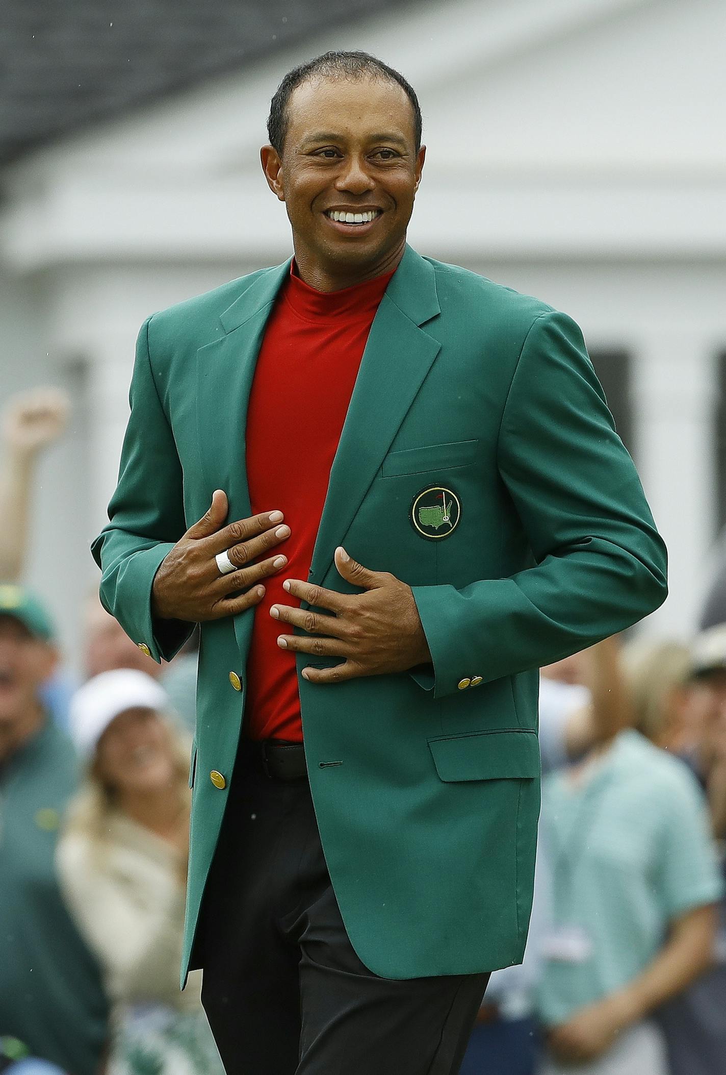 Tiger Woods smiles as he wears his green jacket after winning the Masters golf tournament Sunday, April 14, 2019, in Augusta, Ga. (AP Photo/Matt Slocum)