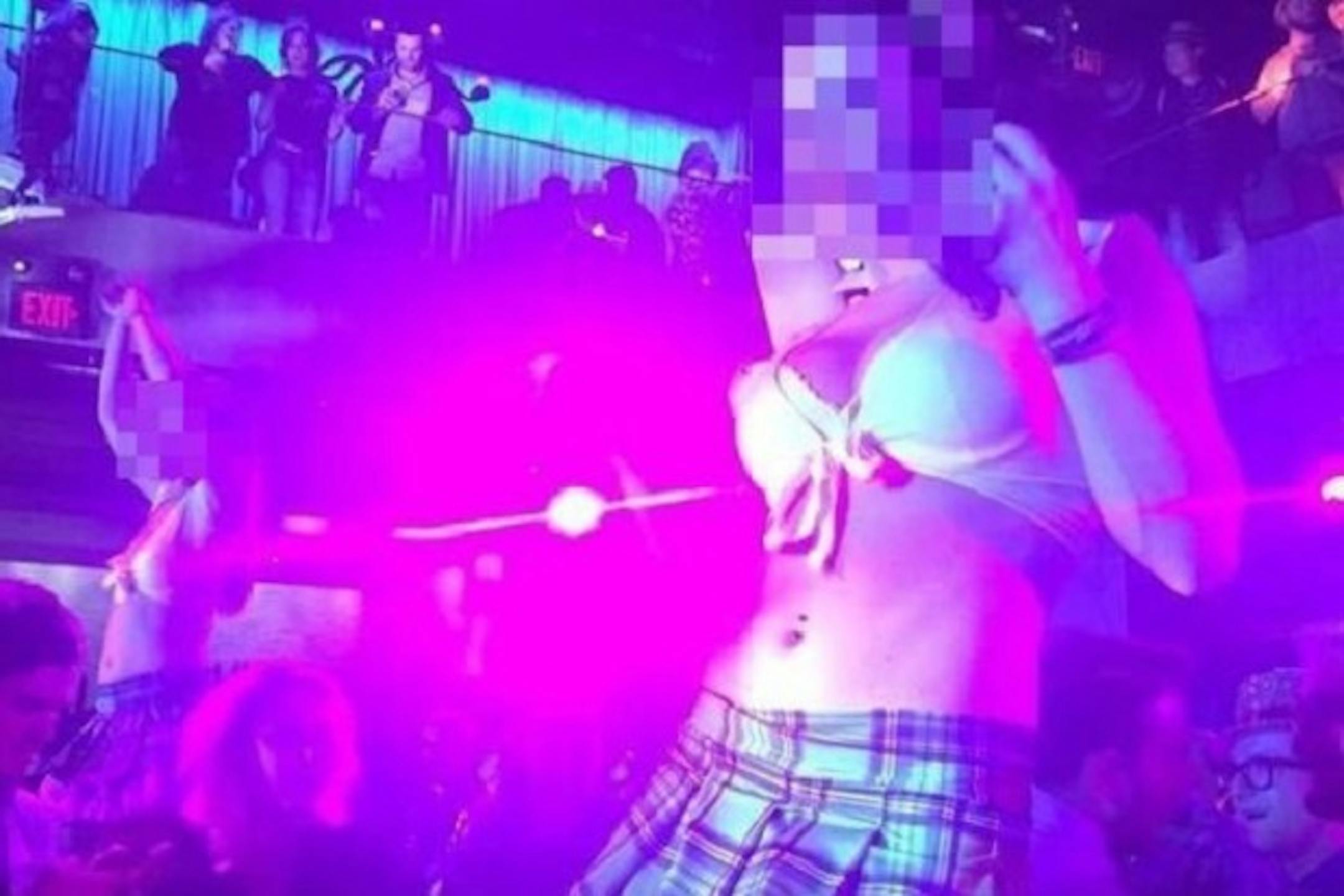 A dancer, with her face blurred by the photographer to hide her identity, performs at an Xbox party sponsored by Microsoft, as captured by an attendee and posted on Twitter.