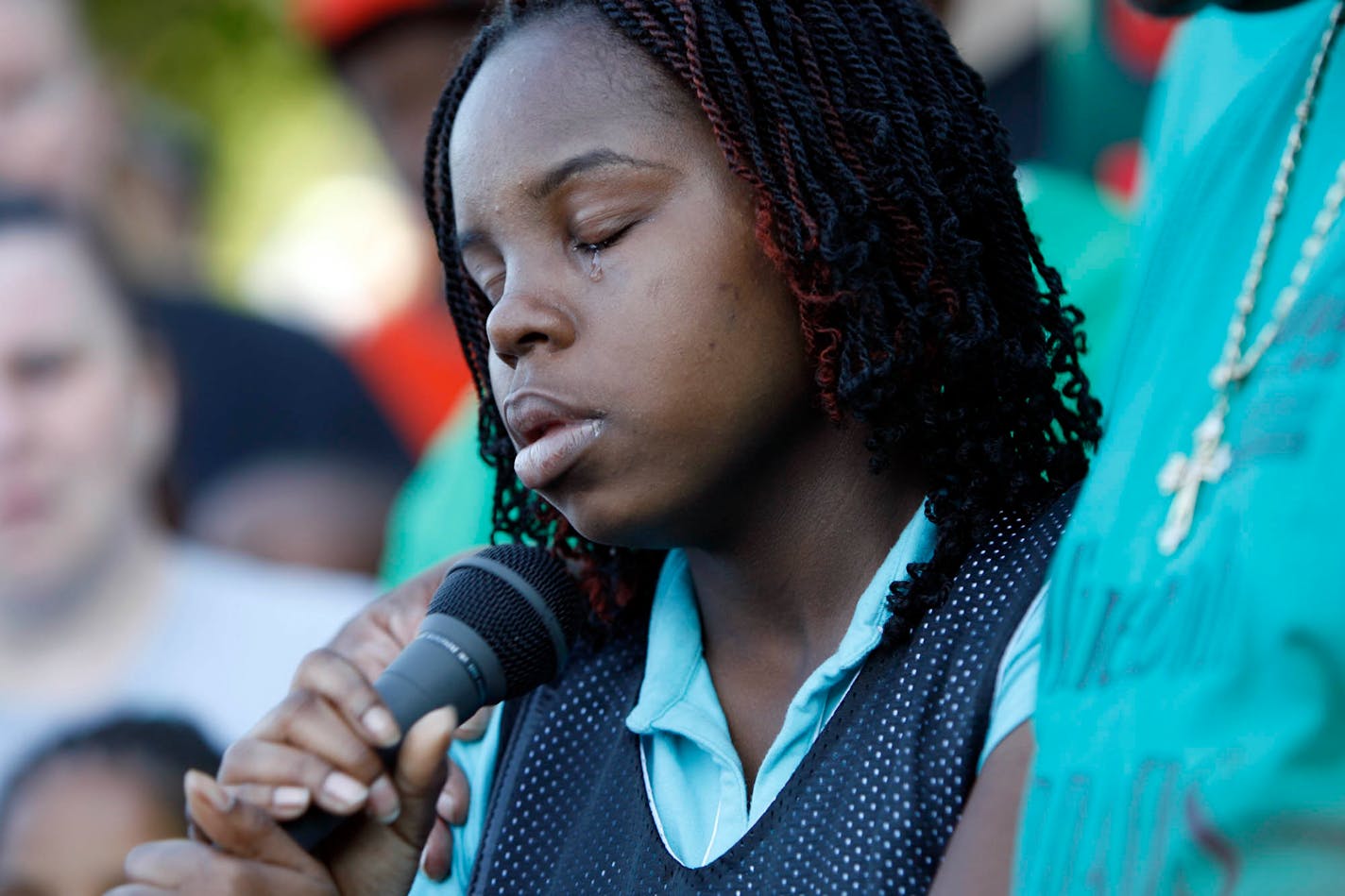 Brandy Daniels talked about her mother and Robert Shepard on Monday night after the blockwide crowd walked to Dr. Martin Luther King Jr. Park.