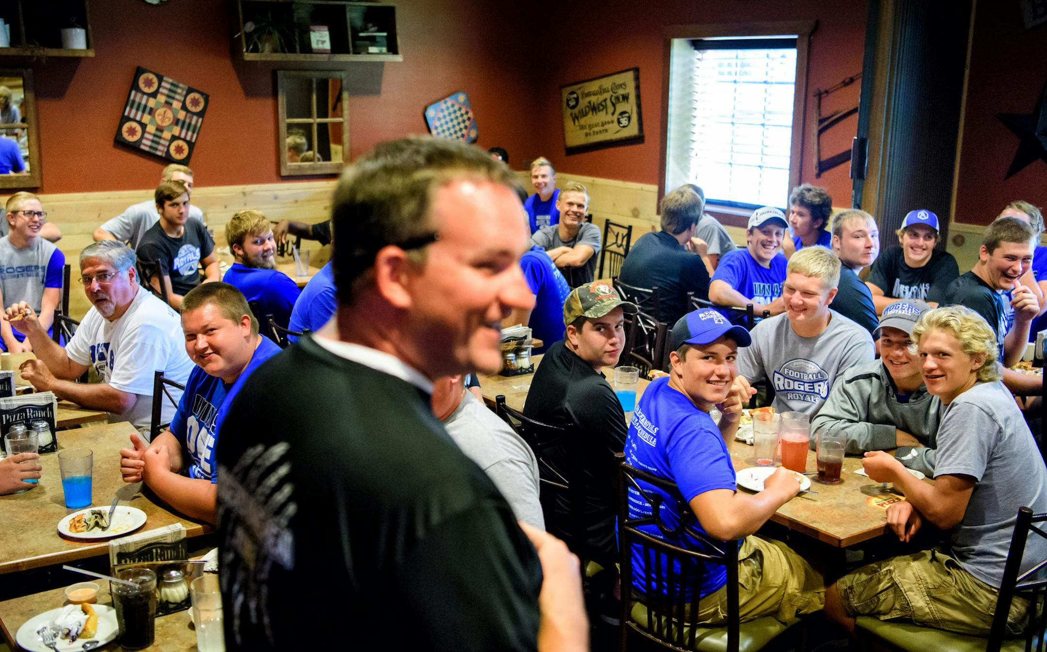 Rogers offensive line coach Ken Worel gave a shout-out to the Royals linemen during one of their bonding rituals -- a buffet meal.