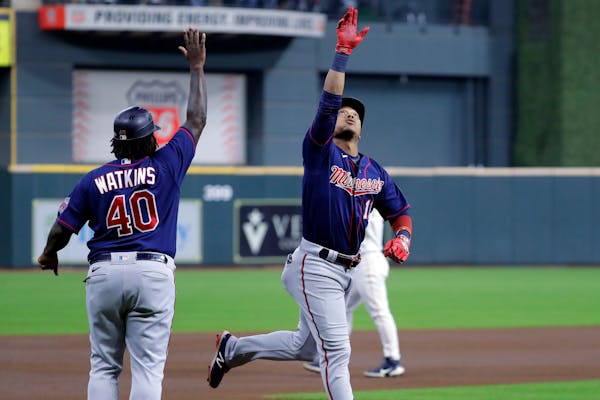Twins third base coach Tommy Watkins, above celebrating with Jorge Polanco on a homer in August, has made several bad decisions recently on sending ru