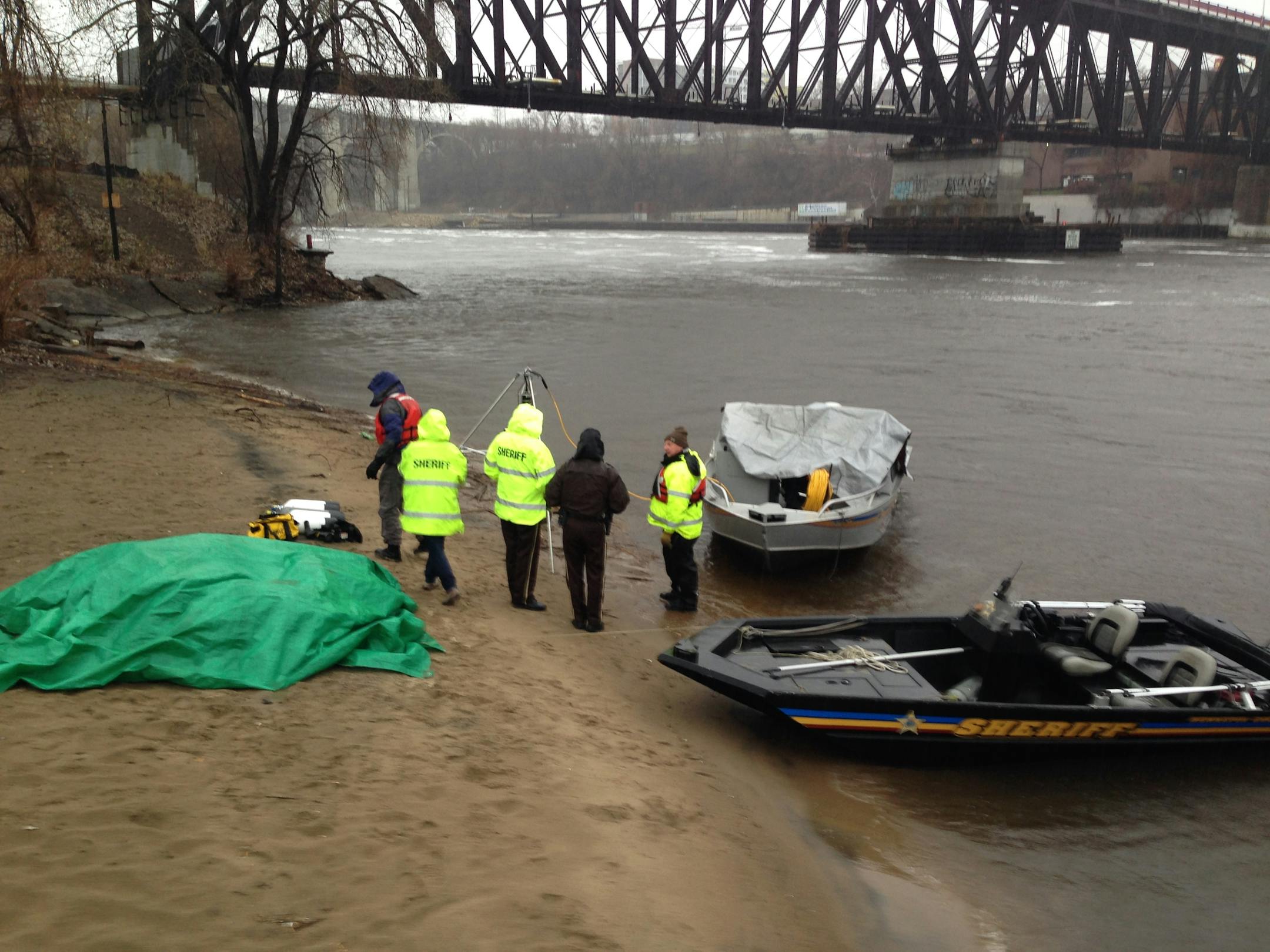 Members of the Hennepin County Water Patrol were on the west bank of the Mississippi River southeast of downtown Minneapolis Sunday to search for a car that went into the river.