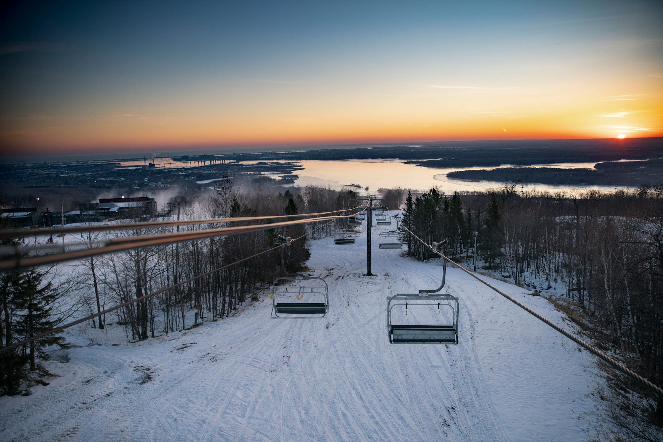 The sun rose over Spirit Mountain casting light on Lake Superior and the St. Louis River on Wednesday December 2, 2020.    ]