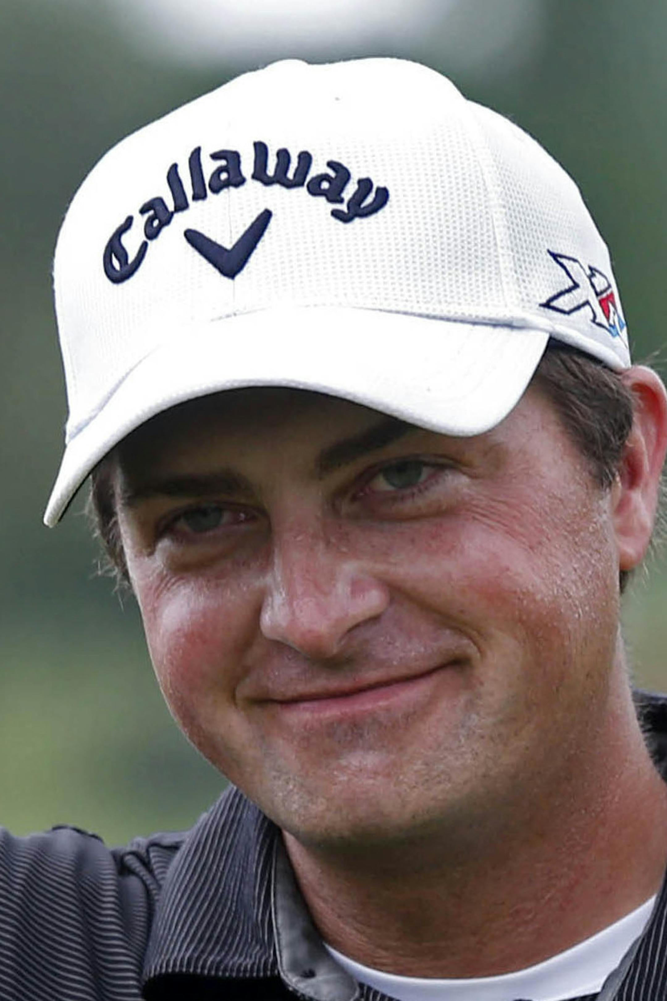 Brian Stuard holds up the tournament trophy after winning the PGA Zurich Classic golf tournament at TPC Louisiana in Avondale, La., Monday, May 2, 2016. The tournament was shortened to 54 holes due to lengthy rain delays all weekend. (AP Photo/Gerald Herbert)