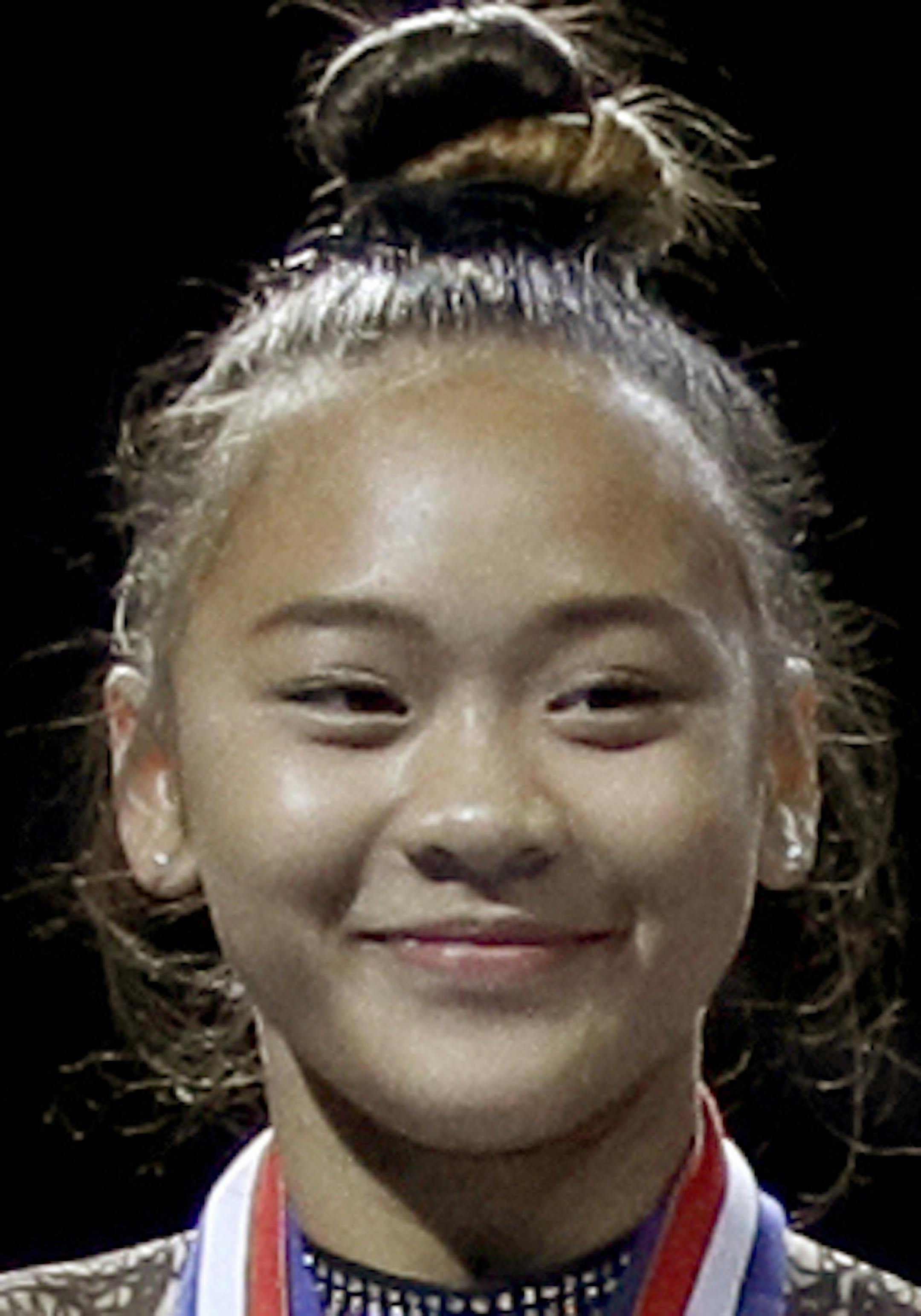 All-around winner Simone Biles, center, stands on the podium with second place finisher Sunisa Lee, left, and third place finisher Grace McCallum after the senior women's competition at the 2019 U.S. Gymnastics Championships Sunday, Aug. 11, 2019, in Kansas City, Mo. (AP Photo/Charlie Riedel) ORG XMIT: MER2151b7a0944a88b6658b2b4775227