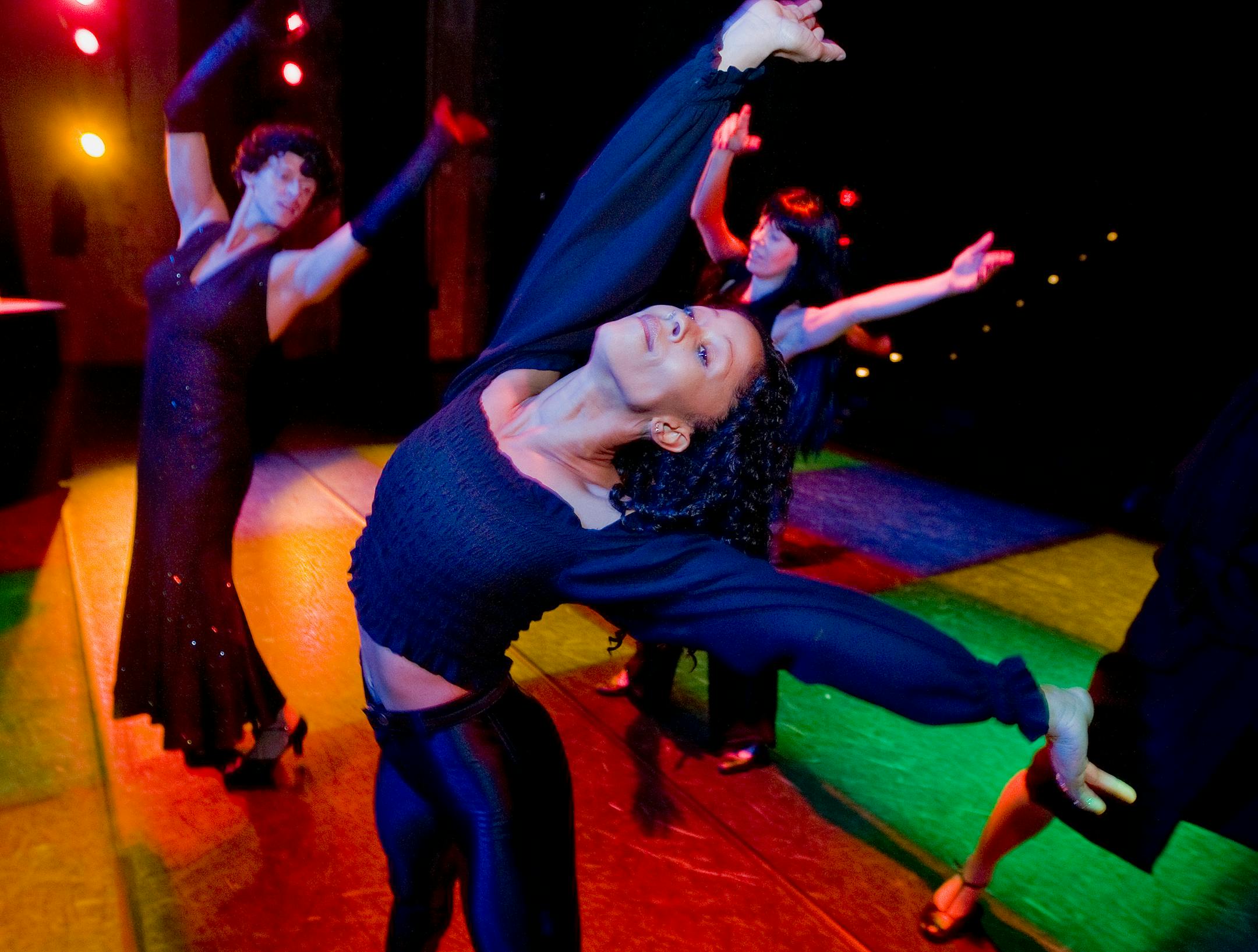 Joel Klausler, left, Stephanie Fellner and Zhauna Franks do "The Hustle" during rehearsal for Ballet of the Dolls' new disco-themed show, "Born to Be Alive."