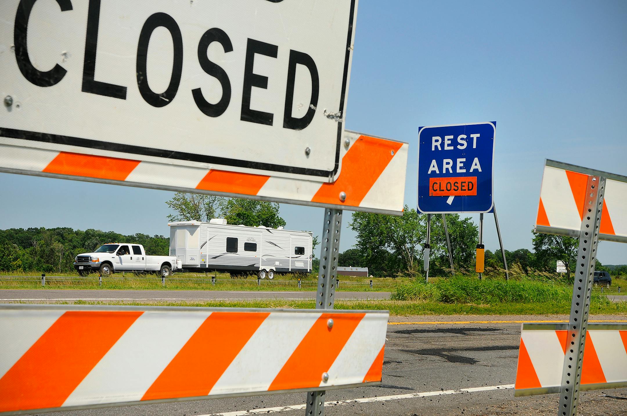 Signs are posted and barricades are out closing the rest areas on the east and west bound lanes of Interstate 94 near Avon, Minn., in June 2011.