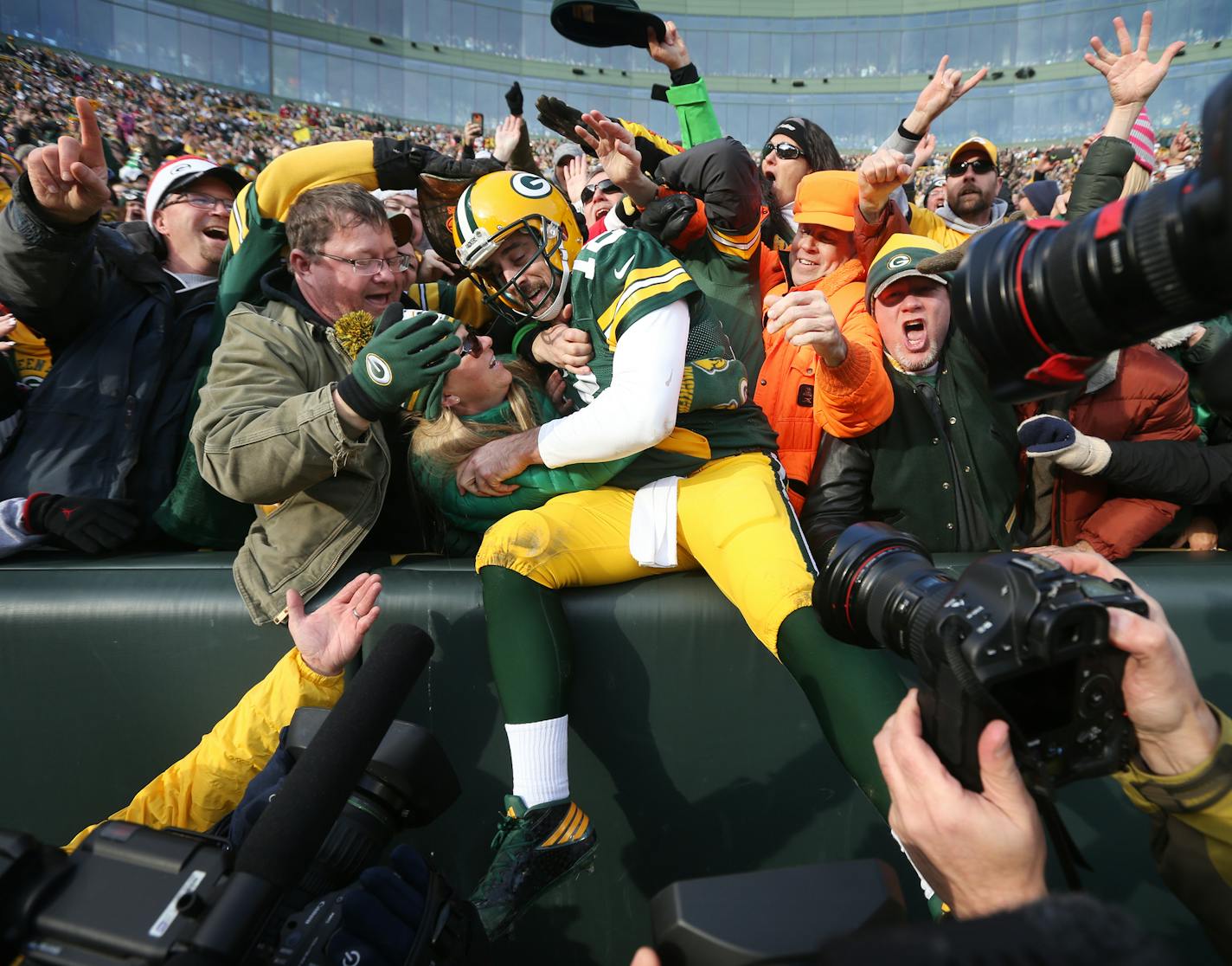 Green Bay Packers quarterback Aaron Rodgers (12) celebrated his second quarter rushing touchdown with fans at Lambeau Field Saturday December 24,2016 in Green Bay, Wis. ] The Green Bay Packers hosted the Minnesota Vikings at Lambeau Field. Jerry Holt / jerry. Holt@Startribune.com