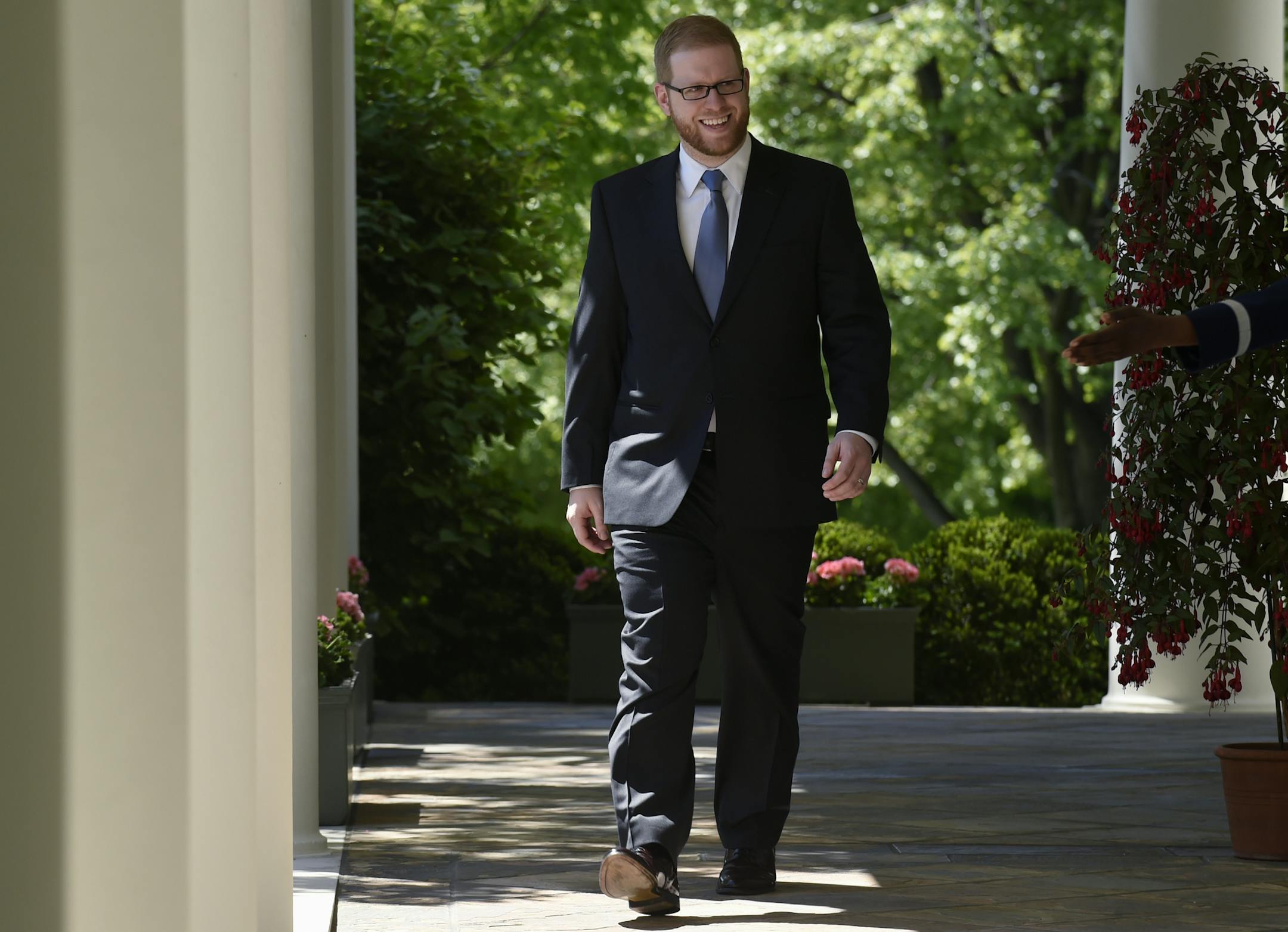 Minnesota Teacher of the Year Thomas Rademacher walks out of the Oval Office and heads to the Rose Garden of the White House in Washington, Wednesday, April 29, 2015, for an event with President Barack Obama to honor the 2015 National Teacher of the Year and finalists. (AP Photo/Susan Walsh)