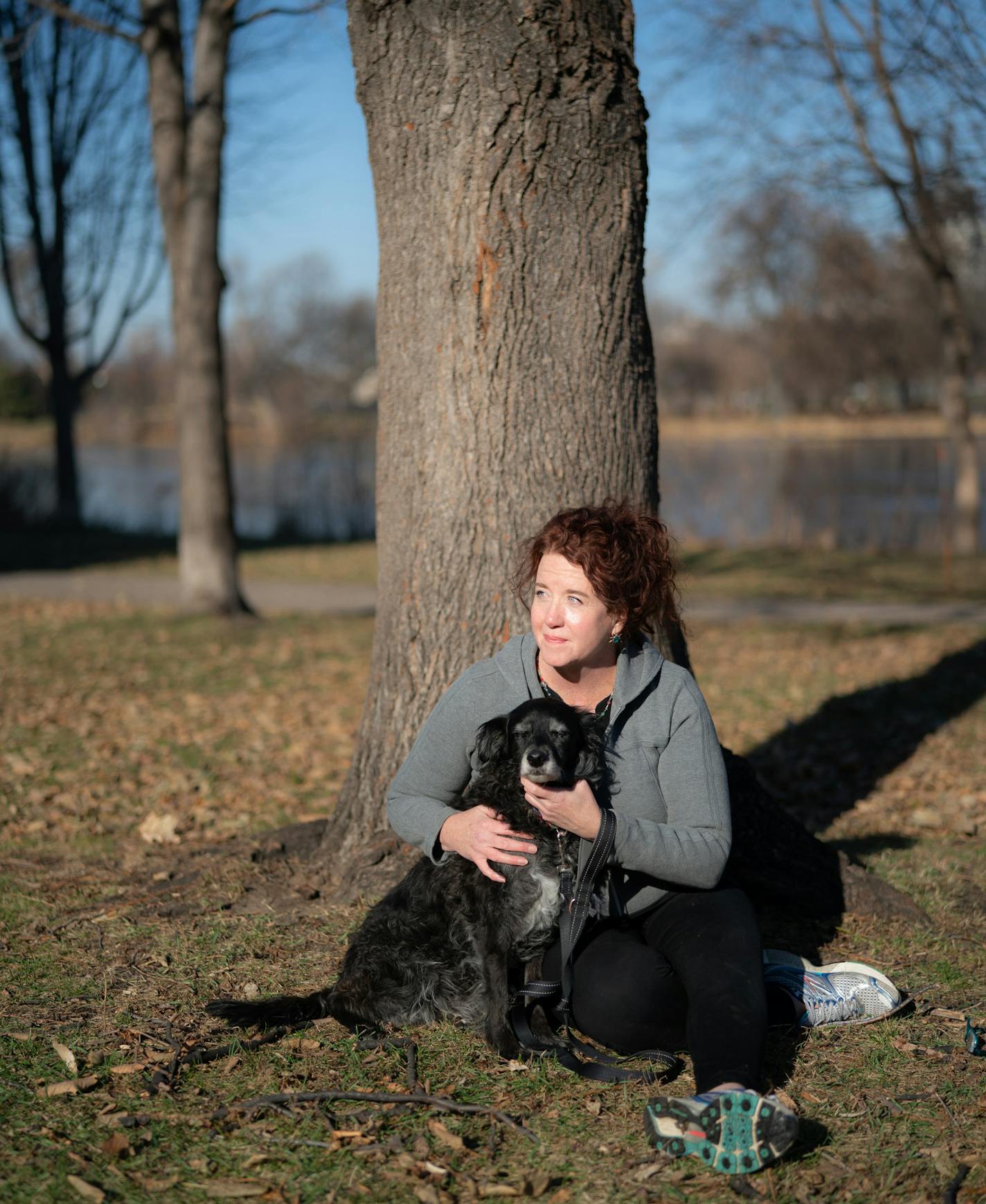 Sheila Delaney, with her dog Morris in Loring Park, which was filled with homeless people living in tents a few months ago.