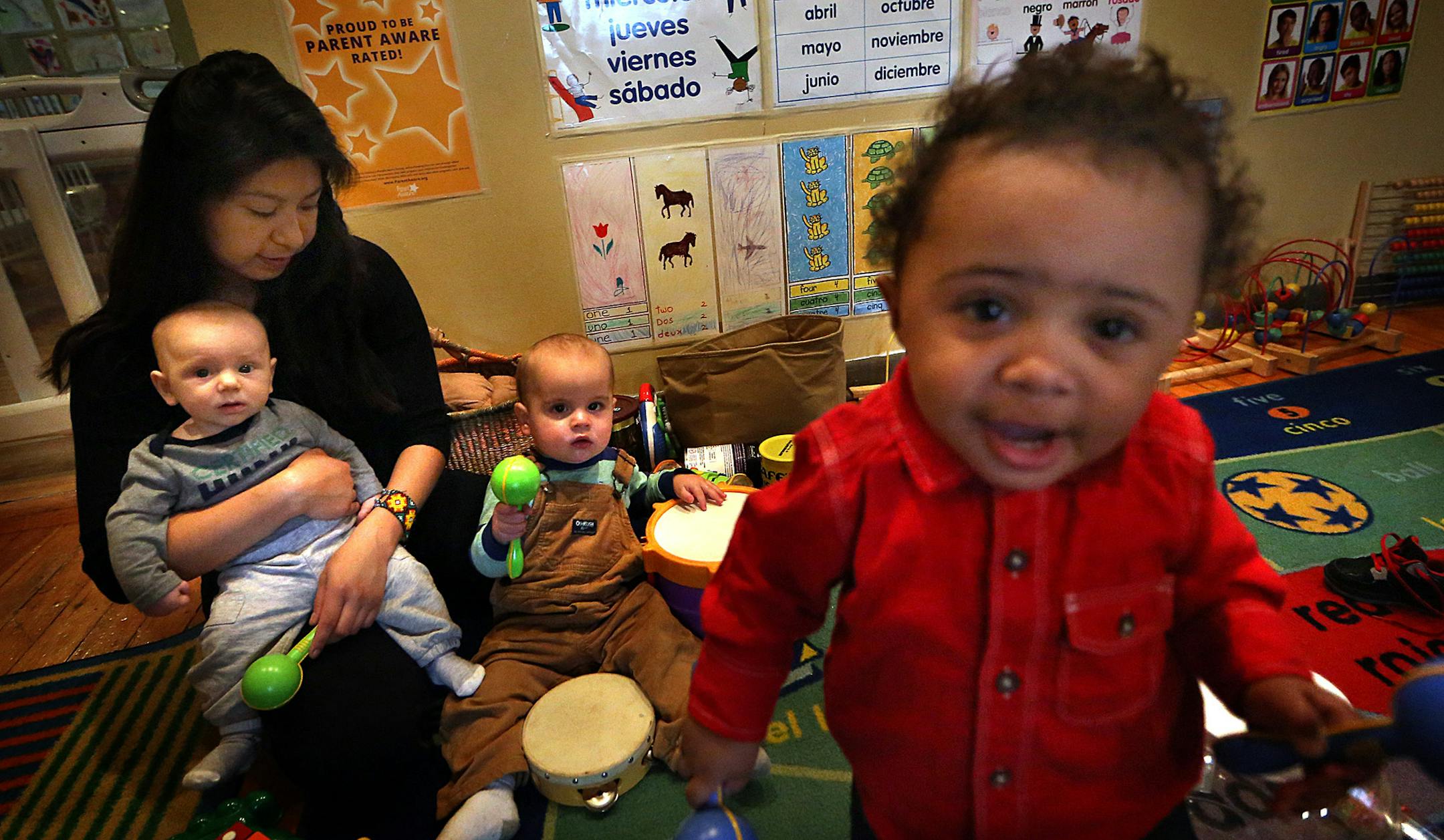 Erika Legros, an assistant to Luciana Carballo-Pierre, worked with children at Carballo-Pierreís 4-star rated, Minneapolis daycare home. ] JIM GEHRZ ï james.gehrz@startribune.com / Minneapolis, MN / April 9, 2015 /11:30 AM - BACKGROUND INFORMATION: At Crystal Born's daycare in Mankato, the toddlers don't spend all day watching TV. They work on their colors and numbers, and on Wednesday they had a scavenger hunt to help them learn their ABCs. That high-octane curriculum earned Born a 4-