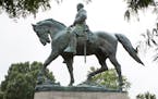 A statue of Confederate general Robert E. Lee sits in Emancipation Park, Tuesday, Aug. 15, 2017, in Charlottesville, Va. (AP Photo/Julia Rendlema) ORG