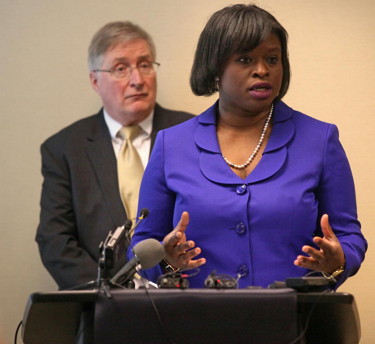 Nekima Levy-Pounds, president of the Minneapolis NAACP, speaks to the press about the lawsuit against Minnesota's top law enforcement agencies to force the release of video footage from the shooting death of Jamar Clark by Minneapolis police last fall.