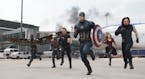 In this image released by Disney, Anthony Mackie, from left, Paul Rudd, Jeremy Renner, Chris Evans, Elizabeth Olsen and Sebastian Stan appear in a sce