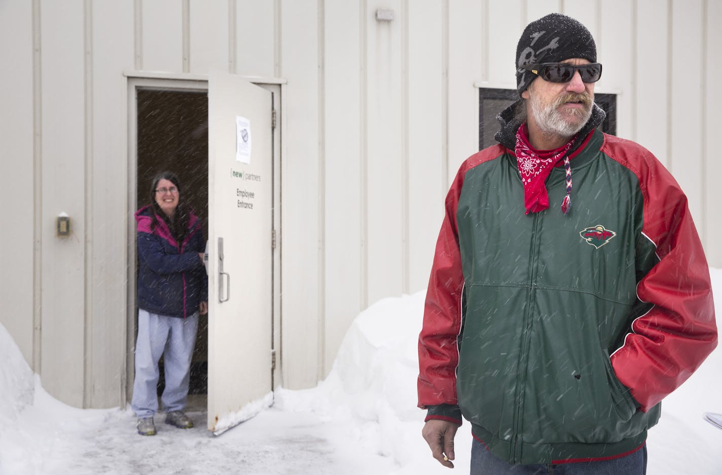 Employee Jack Sperry takes a smoke break outside of New Partners Consultants, which operates a call center in the space that formerly housed Meyer Associates at Progress Park in Eveleth on Tuesday, February 10, 2015. ] LEILA NAVIDI leila.navidi@startribune.com /