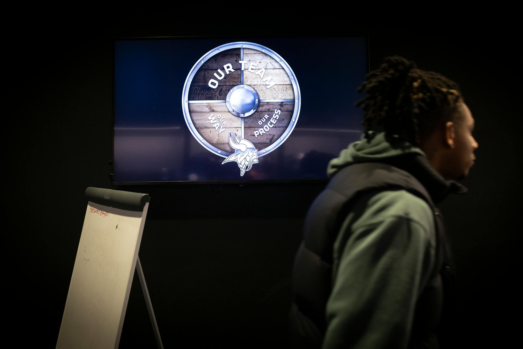 A screen that normally has a schedule posted was replaced by a logo in the locker room at the TCO Performance Center.
