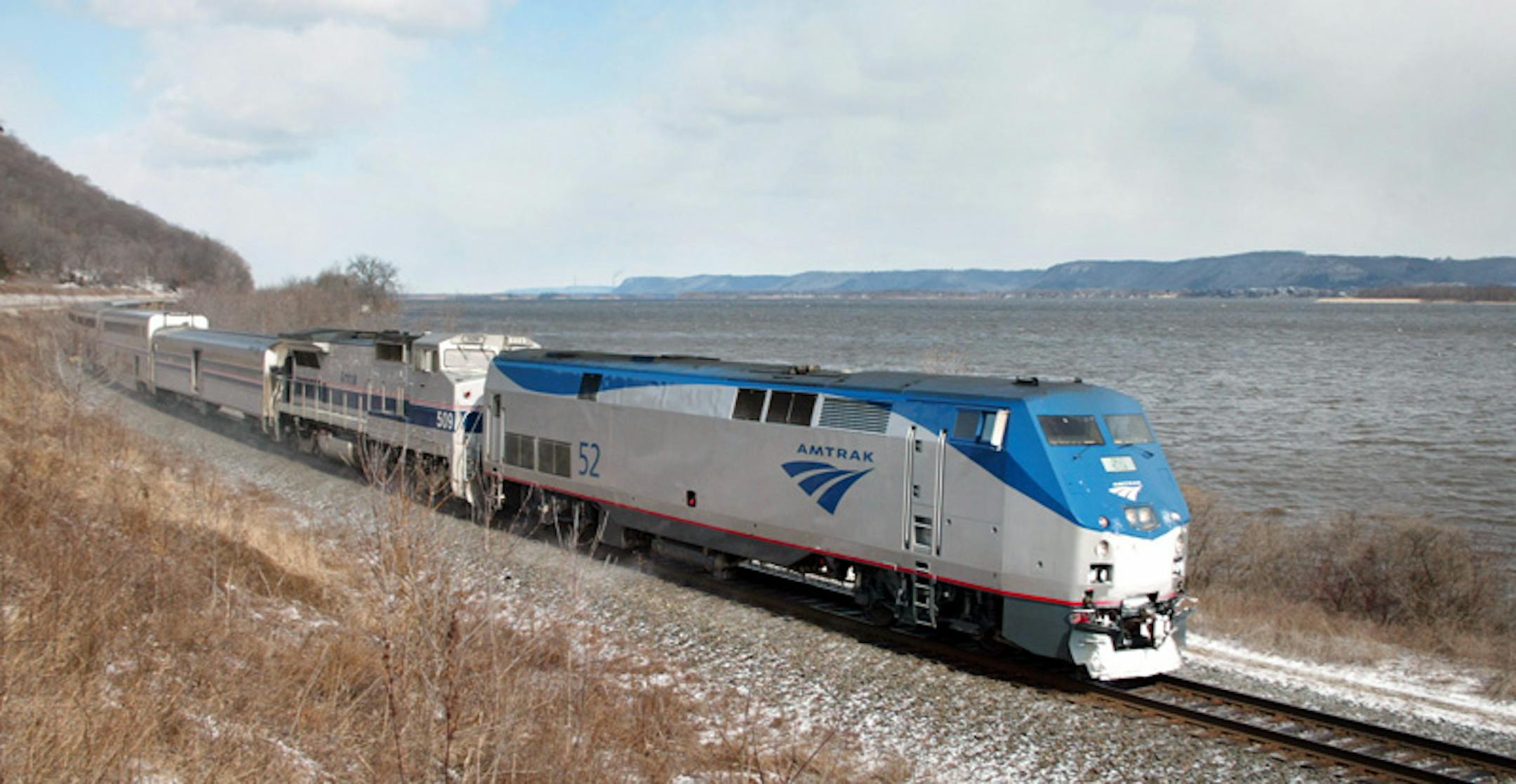 Lake City, MN 3/21/2002 -- The Empire Builder train and route is in jeopodary of being shut down if Congress does not continue its same level of funding. (In This Photo) The Amtrak Empire Builder along the western shore of Lake Pepin south of Lake City, Thursday morning March 21, 2002, heading to Chicago.