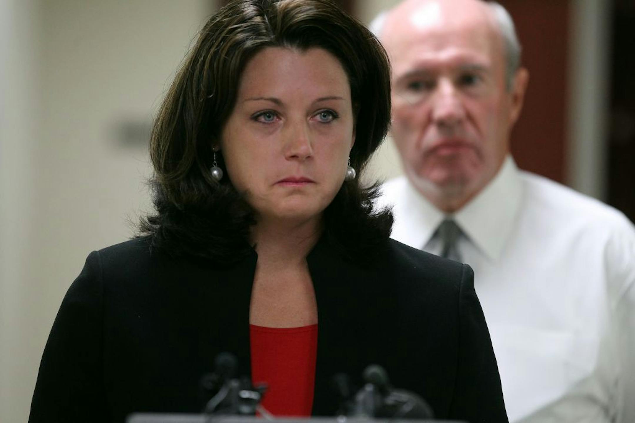 Melodee Hoffner, wife of Minnesota State University, Mankato football coach Todd Hoffner was flanked by her attorney Gerald Maschka as she read a statement saying her husband is innocent of child porn charges filed against him.