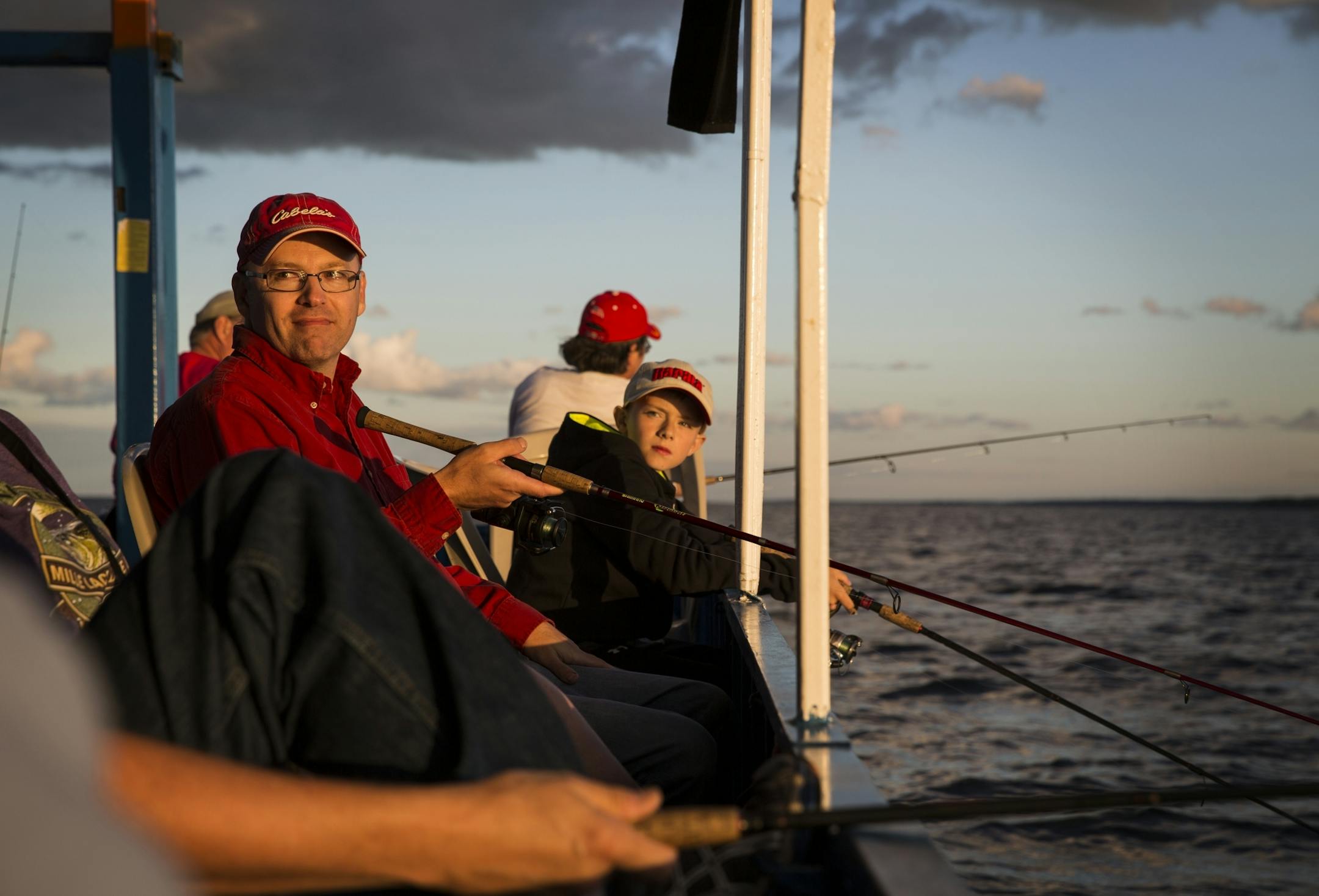 Brent Peterson and his son Wyatt, 10, of Excelsior fish on an expedition with Twin Pines Resort on Mille Lacs Lake Monday, August 3, 2015.
