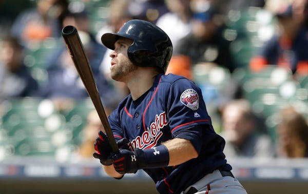 The Twins' Brian Dozier watched his solo home run off Tigers starter Michael Fulmer in the game's first at-bat Wednesday.