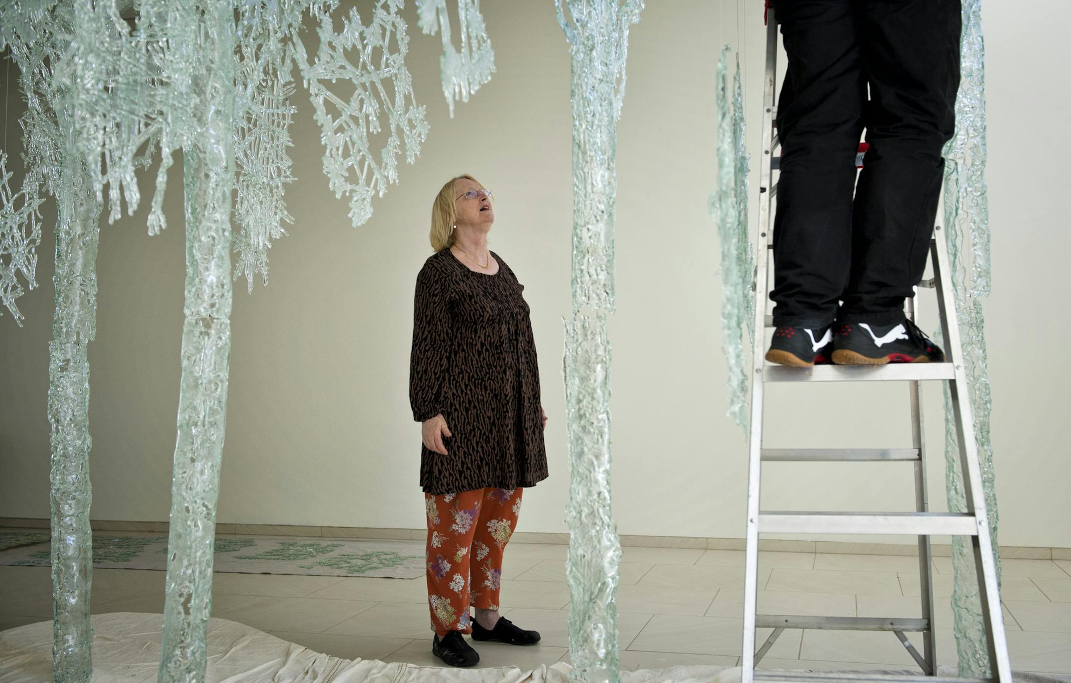 Swedish artist Ingalena Klenell and her husband, Ragnar, installed "Homeland," her glass sculpture consisting of seven trees whose tubular trunks are topped with sparkling crystalline crowns.