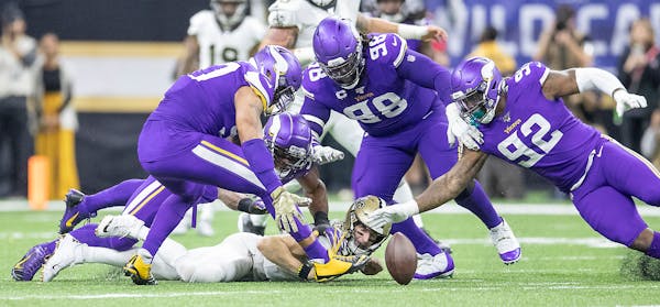 Vikings defensive end Danielle Hunter (second from left) sacked Saints quarterback Drew Brees to force a fumble in the fourth quarter. The Vikings' de