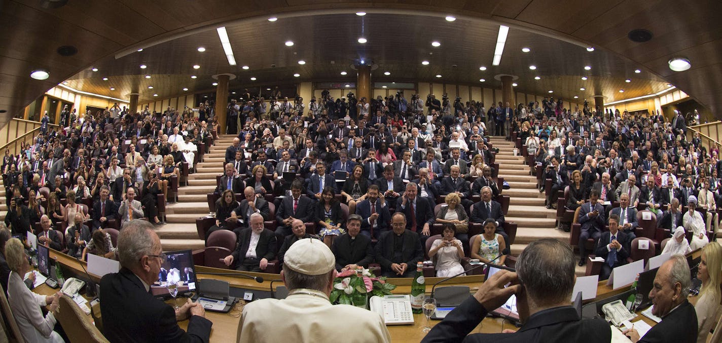 Pope Francis speaks in the Synod Hall during a conference on Modern Slavery and Climate Change at the Vatican, Tuesday, July 21, 2015. Dozens of environmentally friendly mayors from around the world are meeting at the Vatican this week to bask in the star power of eco-Pope Francis and commit to reducing global warming and helping the urban poor deal with its effects. (AP Photo/L'Ossservatore Romano, Pool) ORG XMIT: MIN2015072314404032