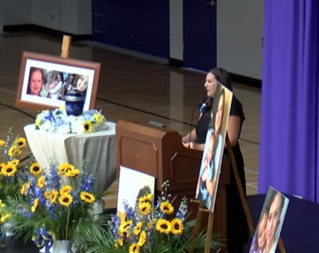 Holly Waterston read stepsister Madeline Kingsbury’s obituary during a memorial service Sunday, June 25, 2023, at McCown Gymnasium at Winona State University in Winona, Minn.
