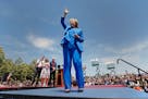 Democratic presidential candidate, former Secretary of State Hillary Rodham Clinton, right, acknowledges supporters as her husband, former President B