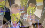 FILE -- Attendees interact with a facial recognition demonstration during the Consumer Electronics Show in Las Vegas, Jan. 8, 2019. The San Francisco 