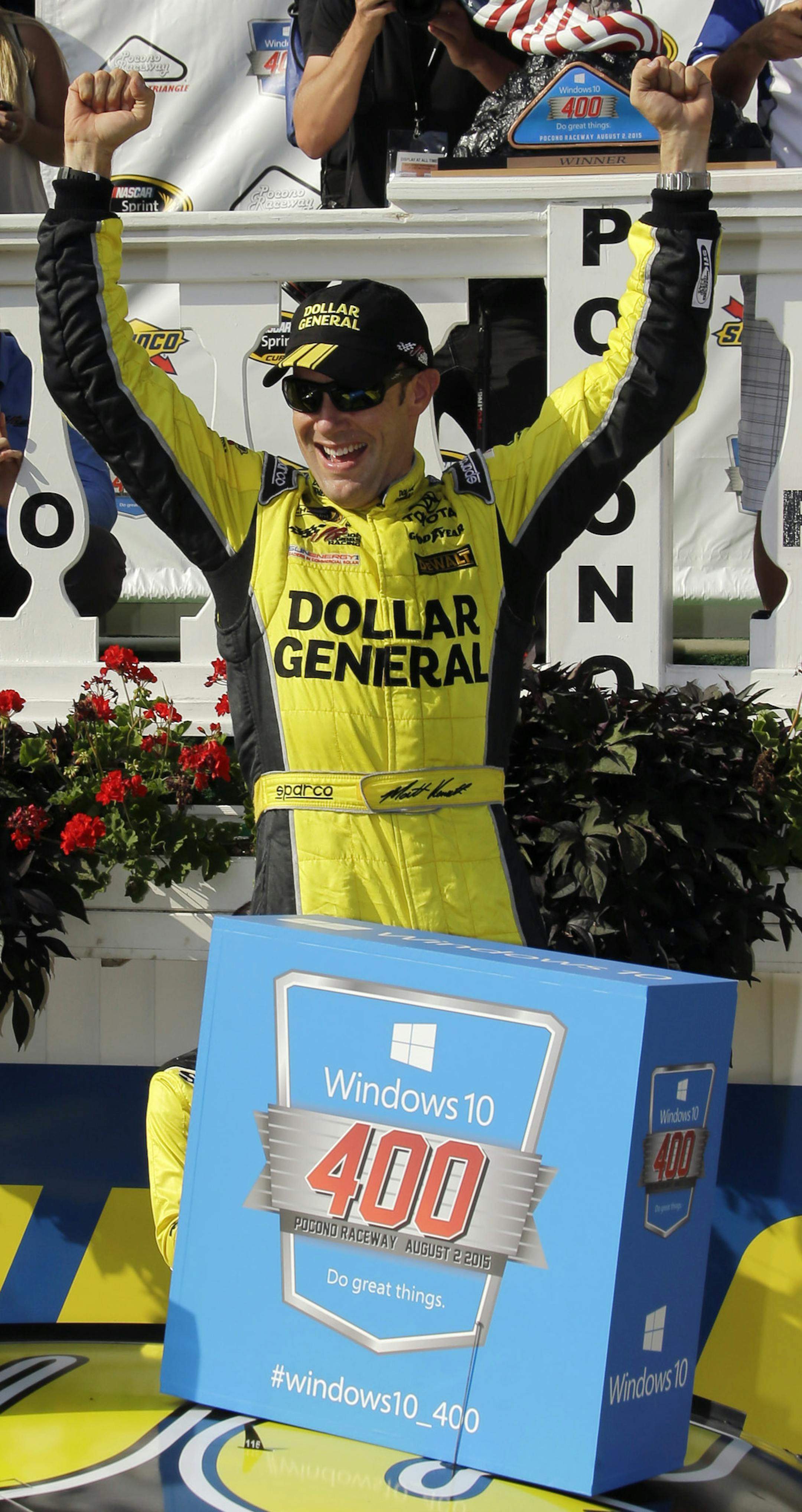 Matt Kenseth celebrates in victory lane after winning the NASCAR Pocono 400 auto race, Sunday, Aug. 2, 2015, in Long Pond, Pa. (AP Photo/Matt Slocum)