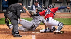 Chicago White Sox DH Jose Abreu ,(79) was tagged out by Minnesota Twins catcher Jose Godoy ,(60) third inning in Minneapolis, Minn., on Sunday, April 