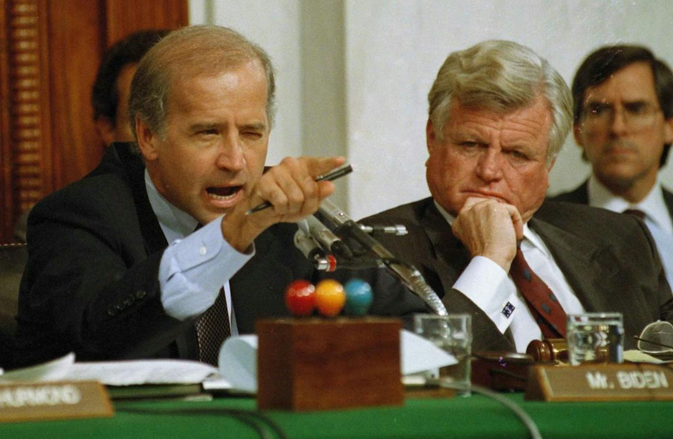 In this Oct. 12, 1991 file photo Senate Judiciary Committee Chairman Joe Biden, D-Del., points angrily at Clarence Thomas during comments at the end of hearings on Thomas' nomination to the Supreme Court on Capitol Hill. Sen. Edward Kennedy, D-Mass. looks on at right.